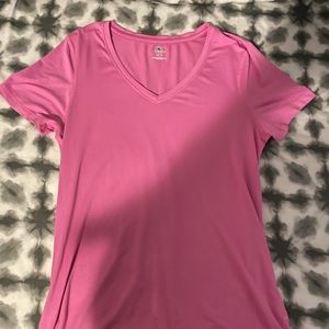 pink athletic top says size small but fits more like a medium